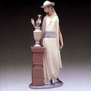 Lladro Spanish porcelain. Casino flapper lady admiring flower.